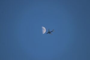 white airplane flying in the sky during daytime